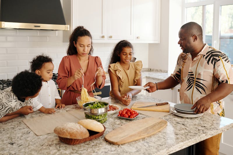 Family working together to prepare a meal — systems in action